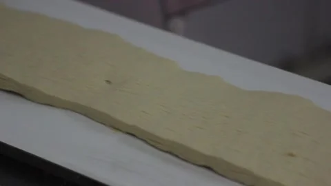 The sweet mix for making sweet bars moves on a conveyor belt. Stock Footage 128642952