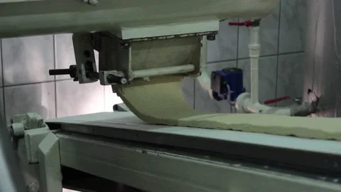 The sweet mix for making sweet bars flows out of the mixer 스톡 동영상 128642962