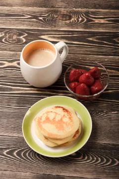 Sweet pancakes with strawberry and coffee Stock Photos