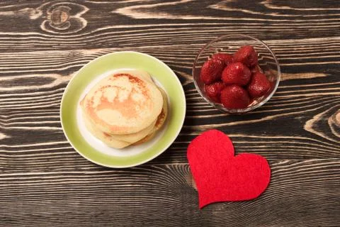 Sweet pancakes with strawberry, handmade heart Stock Photos