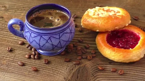 Sweet pastry with fruit jam served with hot coffee Stock Footage 64120318