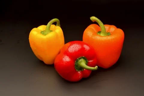 Sweet pepper on black background Stock Photos