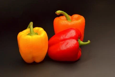 Sweet pepper on black background Stock Photos