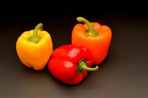 Sweet pepper on black background Stock Photos