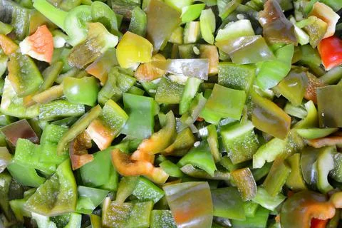 Sweet pepper. Pieces of bell pepper for salad. Russian pepper is cut into pie Stock Photos