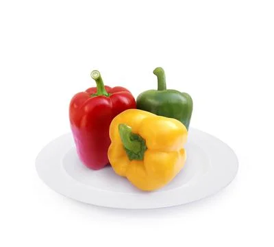 Sweet pepper on plate isolated on white background Stock Photos