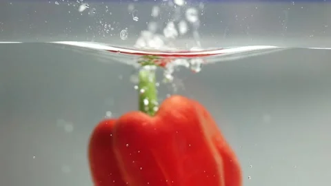 Sweet peppers fall into the water3 Stock Footage 137078713