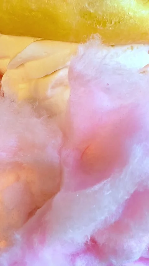 Sweet pink background: candy, cotton candy, donut, cream, marmalade. Dessert. 库存影片 340334745