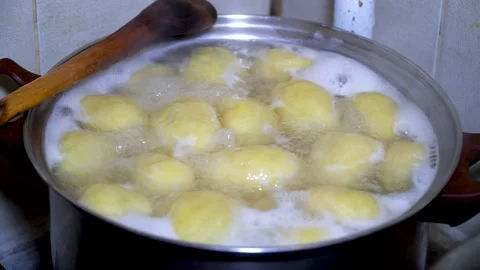 Sweet plum dumpling and a piece of yeast dough. Cooking plum dumplings, hombovci Stock Footage 212680891