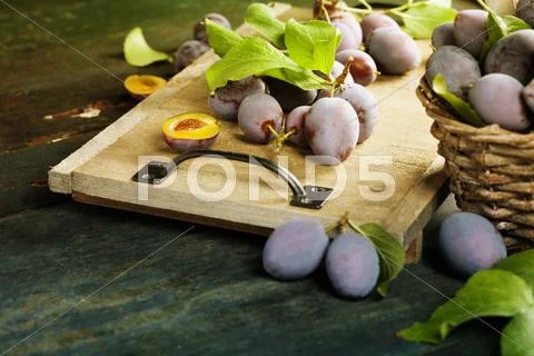 Sweet plums on wooden background Stock Photos