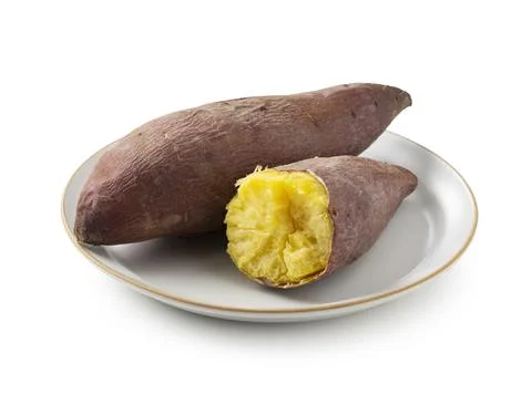 A sweet potato split in half on a white background Foto stock