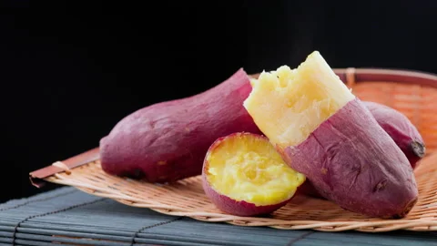 Sweet potatoes with black background Stock Footage 152358167