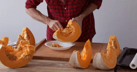 Sweet pumpkin preparing, removing seed Stock Footage 146141354