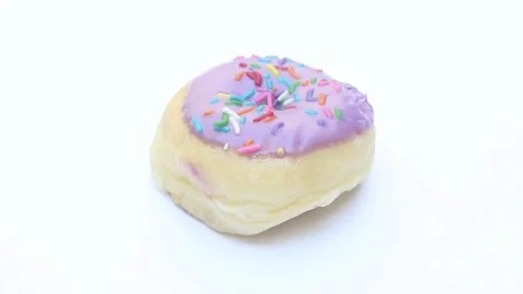 Sweet Purple Doughnut with Jimmies Stock Footage 278073853