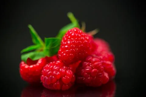 Sweet raspberry fruit isolated on black background Stock Photos