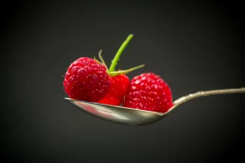 Sweet raspberry fruit isolated on black background Stock Photos
