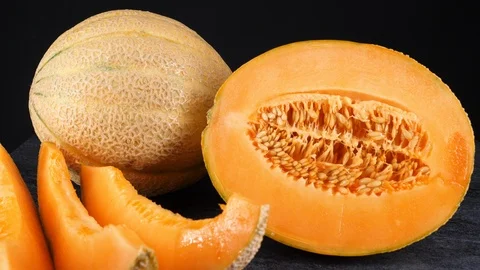 Sweet raw melons isolated on black background Stock Footage 113677092