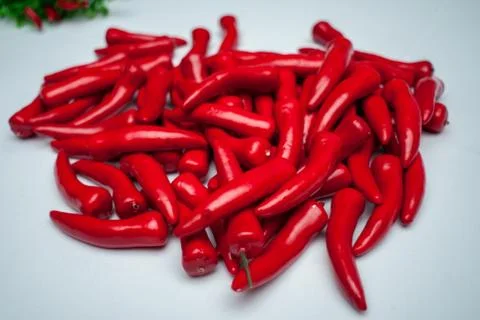 Sweet red pepper kapi, three peppers on white wooden table, pepper, chile, ch Stock Photos