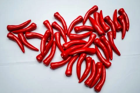 Sweet red pepper kapi, three peppers on white wooden table, pepper, chile, ch Stock Photos