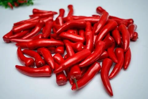 Sweet red pepper kapi, three peppers on white wooden table, pepper, chile, ch Stock Photos