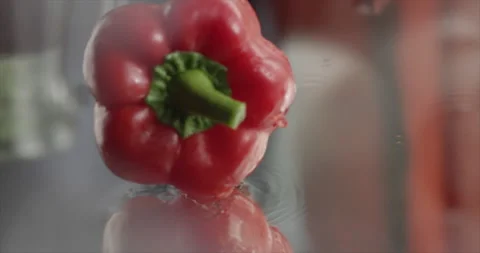 Sweet red pepper spin on a mirror surface Video stock 200255433