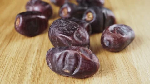 Sweet ripe dates on a wooden surface 動画素材 131625314