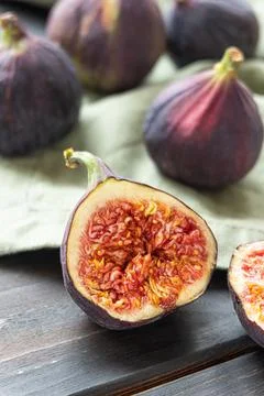 Sweet ripe figs on a dark background Stock Photos
