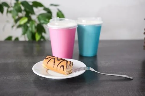 Sweet roll on a plate. Stock Photos