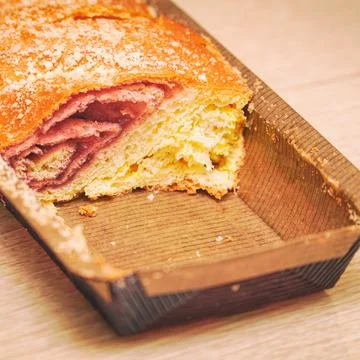 Sweet roulade from the store on the table Stock Photos