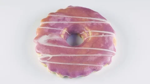 Sweet round bagel on a light background close up Stock Footage 106443774
