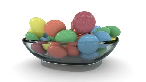 Sweet round candy falling into a glass bowl Stock Footage 319486797
