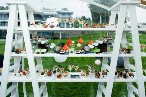 Sweet snacks at the buffet table. Different canapes Stock Photos
