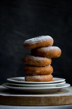 Sweet Sugar Donuts in stack on plates Stock Photos