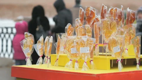 Sweet sugar lollipops of different shape at street Stock Footage 87676330