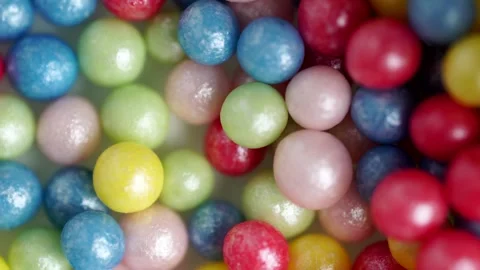 Sweet sugar sprinkles, multicolor balls, macro video. Multicolored sprinkle.. Stock Footage 261542353