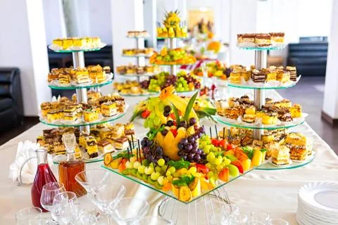 Sweet table with fruit, biscuits and chocolates.. Wedding catering. Candy and Stock Photos
