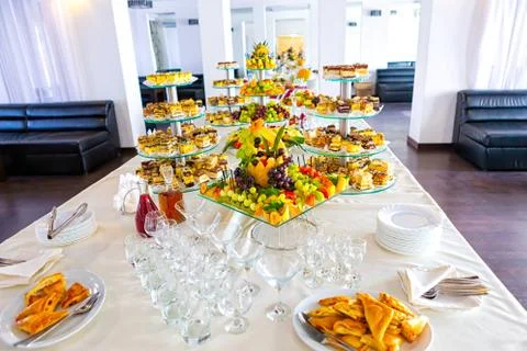 Sweet table with fruit, biscuits and chocolates.. Wedding catering. Candy and Stock Photos