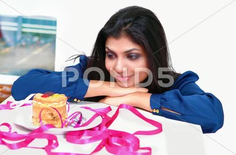 Sweet temptation the girl and the cake Stock Photos