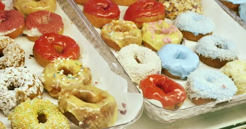 Sweet Temptations: Explore the World of Donuts Stock Footage 274879570