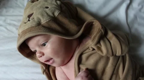 Sweet tiny baby wrapped up in his bath towel Vídeos de archivo 58894901