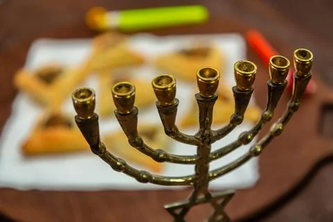 Sweet triangular gomentashi ears of aman for the holiday of Purim on the tabl Stock Photos