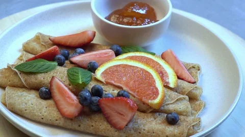 Sweet wrapped pancakes Stock Footage 125312064