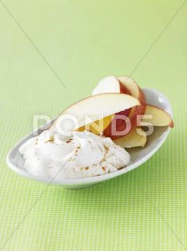 Sweet Yogurt with Apple Slices and Sprinkled Cinnamon Stock Photos