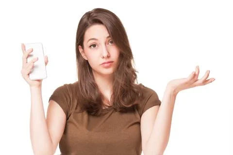 Sweet young brunette using mobile phone. Stock Photos