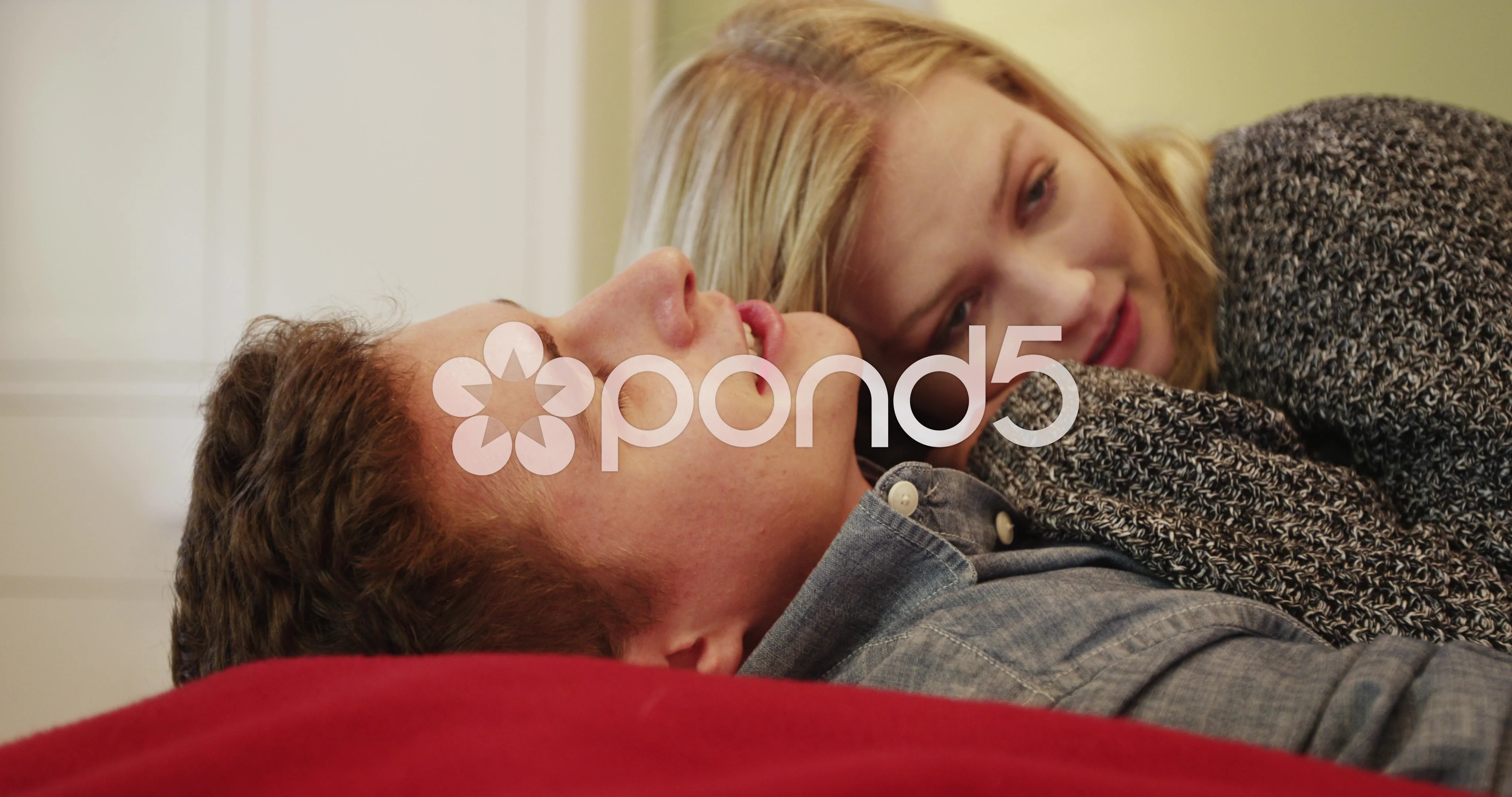 Sweet young couple cuddling in bed | Stock Video | Pond5