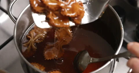 Sweetening up chebakia: the syrup bath Stock Footage 236541930