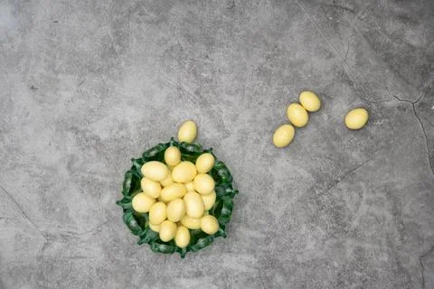 Sweets Almonds in white chocolate,chocolate easter eggs in a green vase Stock Photos