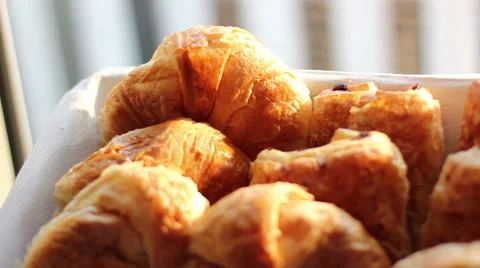 Sweets and bread for breakfast in the morning sun. Stock Footage 40418820