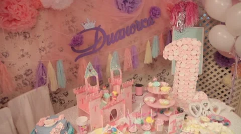 Sweets and decorations on the table to celebrate 1 year baby Stock Footage 63783314