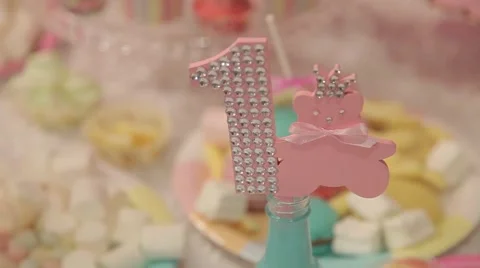 Sweets and decorations on the table to celebrate 1 year baby Stock Footage 63783341